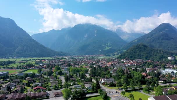 Aerial view over the city of Interlaken in Switzerland. Beautiful view of Interlaken town, Eiger, Monch and Jungfrau mountains and of Lake Thun and Brienz. Interlaken, Bernese Oberland, Switzerland. - Footage, Video