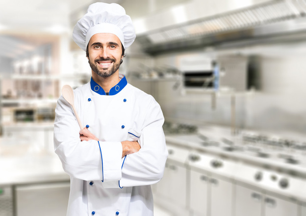 Confident chef in professional kitchen - Foto, afbeelding