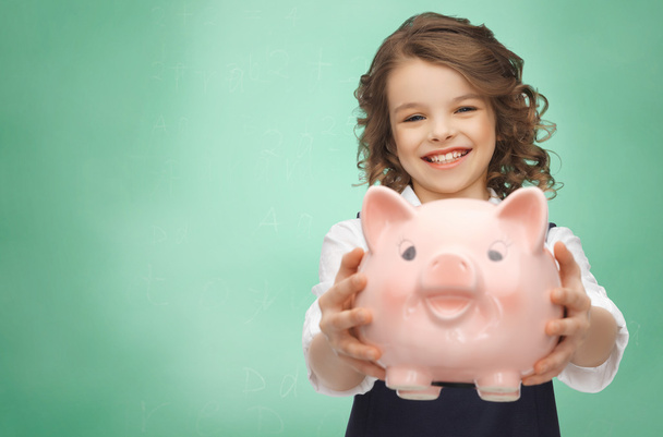 happy girl holding piggy bank - Фото, изображение