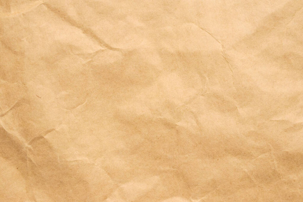 Resumen arrugado y arrugado reciclar fondo de textura de papel marrón - Foto, imagen