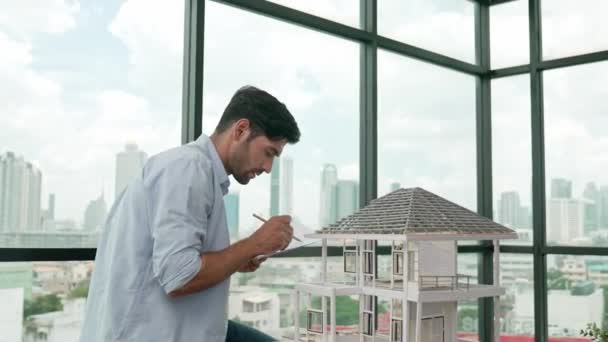 Professional architect engineer comparing between blueprint house model. Businessman decide to invested money in real estate project. Project manager checks house by comparing with plan. Tracery - Footage, Video