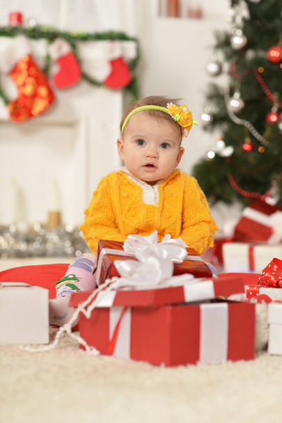 Baby girl with Christmas gifts - Foto, Imagen