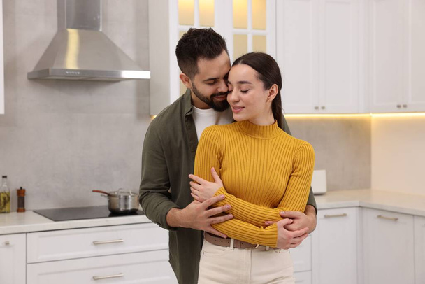 Lovely couple enjoying time together in kitchen - Foto, Imagen