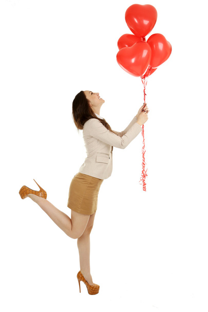 Beautiful woman with red balloons - Фото, изображение
