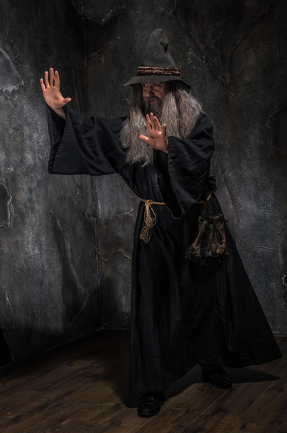 Old sorcerer in hat - Фото, изображение