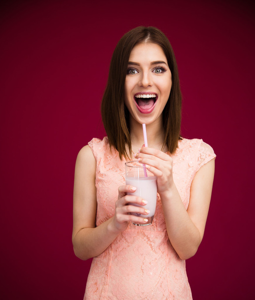 Cheerful woman drinking yogurt - Foto, Imagem