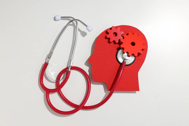 Epilessia concetto giorno, testa di carta umana con stetoscopio - Foto, immagini
