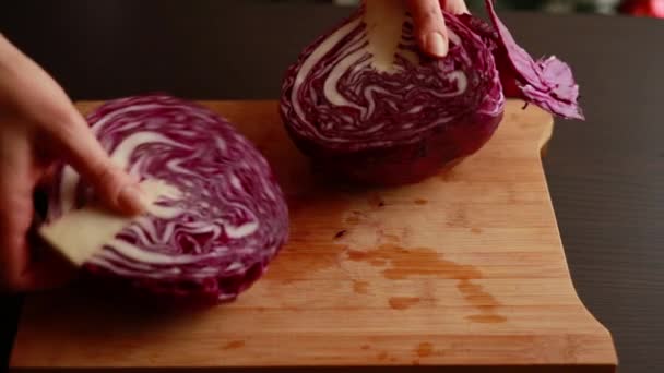 Woman Hands Cutting Slicing Red Cabbage on Wooden Board - Culinary Precision in Action - Footage, Video