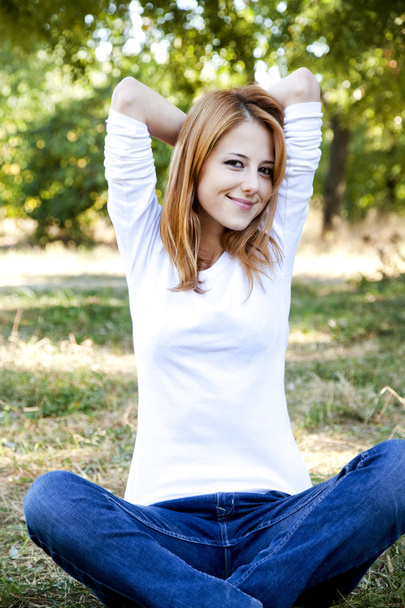 Portrait redhead girl at outdoor. - Foto, afbeelding