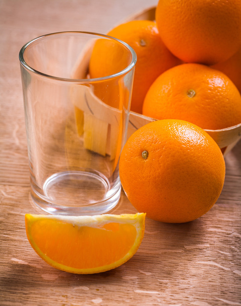 Empty glass and oranges - Фото, изображение