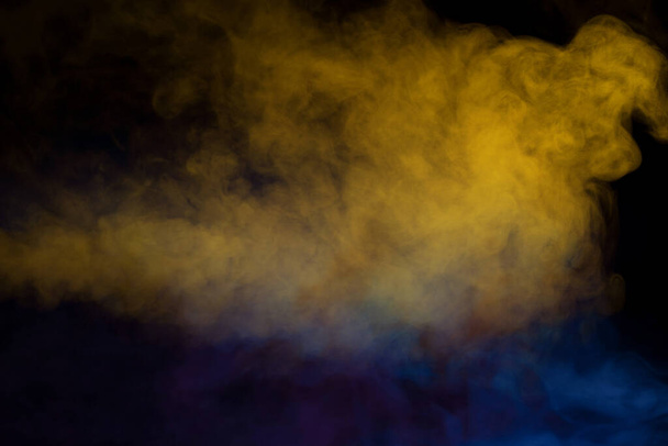Blue and purple steam on a black background. Copy space. - Photo, Image