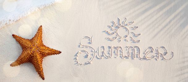 Abstract summer tropical holidays banner; sandy beach and wave on the edge of clear water, starfish on the sand and an inscription on the sand; summer vacation concept banner with copy space - Photo, Image