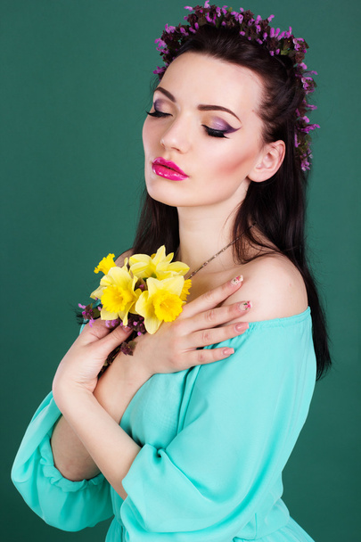 Fashion portrait of girl with purple flowers wreath in hair - Fotó, kép
