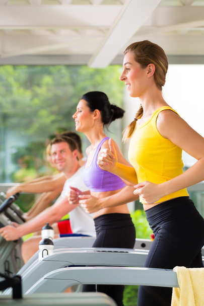 People in sport gym on treadmill running - Photo, Image
