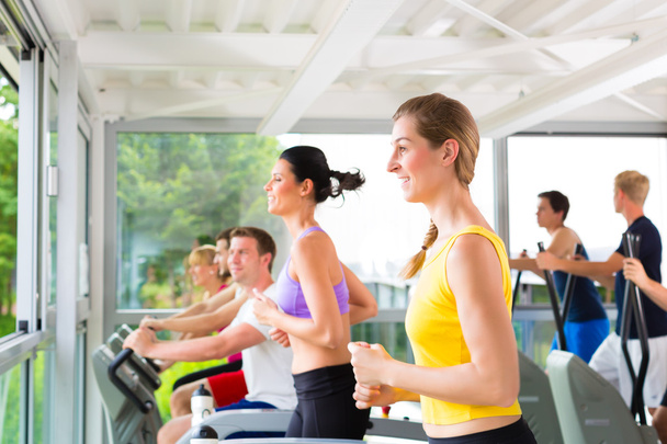 People in sport gym on treadmill running - Photo, Image