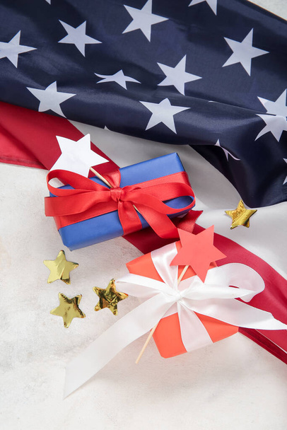 Gift boxes with USA flag and stars on white background. American Independence Day - Photo, Image