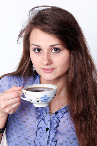 Beautiful brunette lady drinking bracing coffee - Фото, изображение