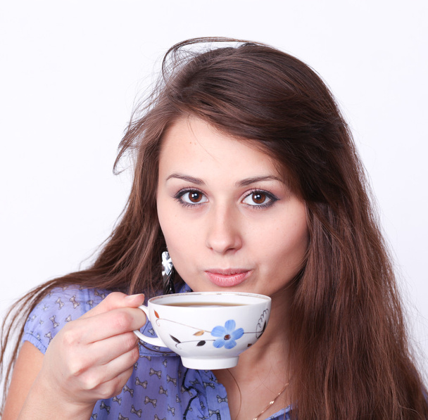 Beautiful brunette lady drinking bracing coffee - Photo, Image