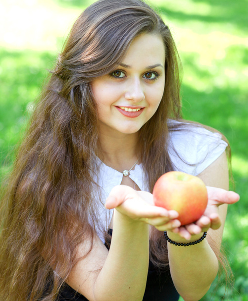 Gorgeous young girl with sappy apple - Zdjęcie, obraz