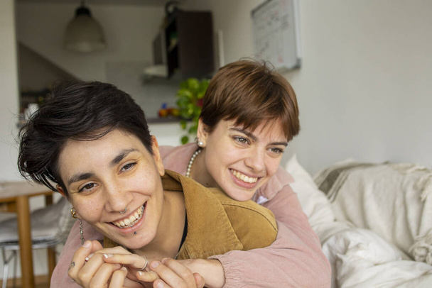 Same sex couple at home spending time. . High quality photo - Photo, Image