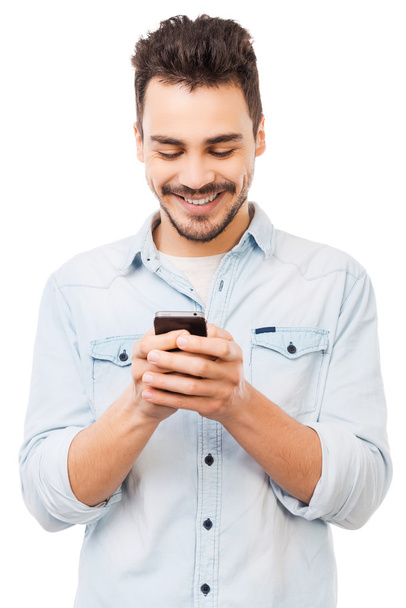 Young man holding mobile phone - Photo, Image