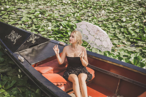 Concept of peaceful and relax. European lady in gondola resting - Photo, Image