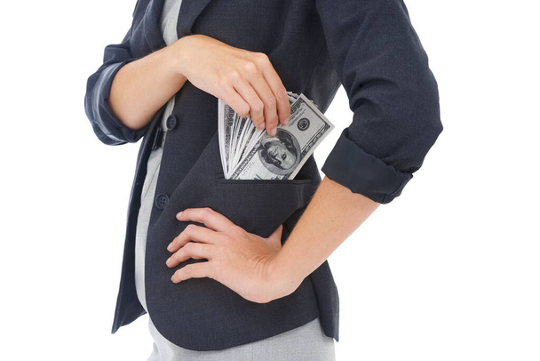 Cash, pocket or hands businesswoman in studio for illegal payment, corruption deal or secret scam. Closeup, white background or financial manager with dollars for bribery, fraud or money laundering. - Photo, Image