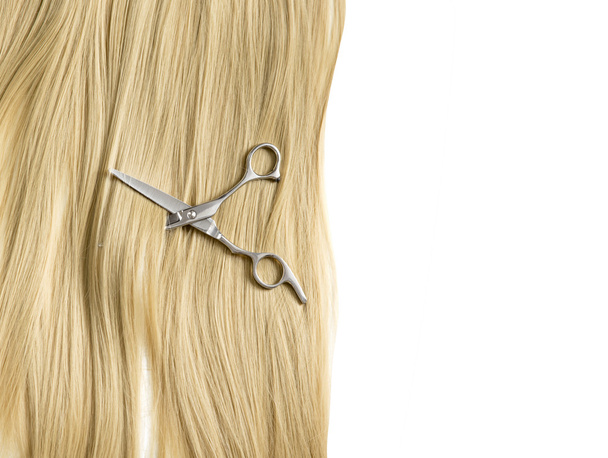 Scissors to cut a lock of hair background blond hair - Foto, Bild