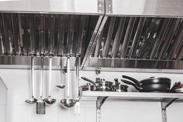 professional hood in a restaurant kitchen made of stainless steel with galvanized duct - Photo, Image