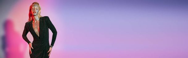 banner of elegant woman with glitter makeup and sparkling dress posing on pink purple gradient - Photo, Image