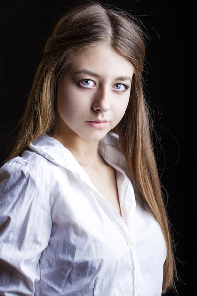Portrait of beautiful young woman in white shirt - Fotoğraf, Görsel