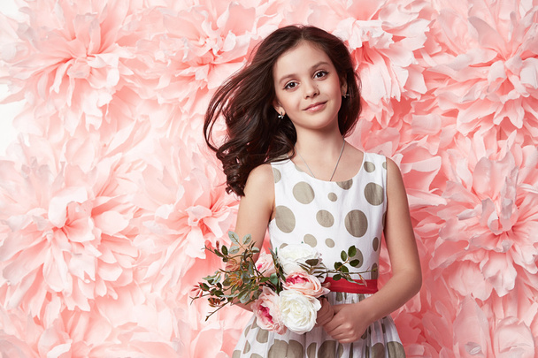 Beautiful little girl in cute dress with flower - Zdjęcie, obraz