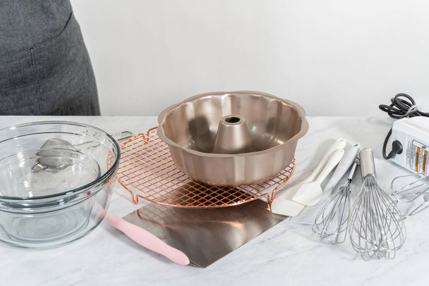 Kitchen tools for baking bundt cakes on the kitchen counter. - Photo, Image