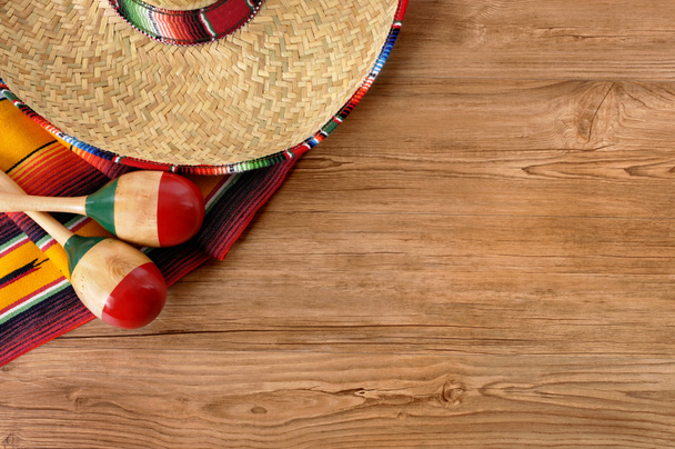Mexican sombrero and blanket on pine wood floor - Photo, Image