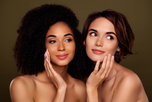 Portrait of two tender lady use new moisturizing cream for face skin look copyspace isolated on khaki color background. - Photo, Image