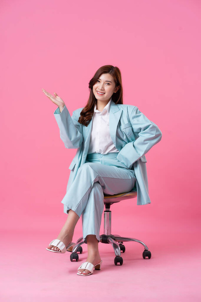 Asian businesswoman portrait on pink background - Photo, Image