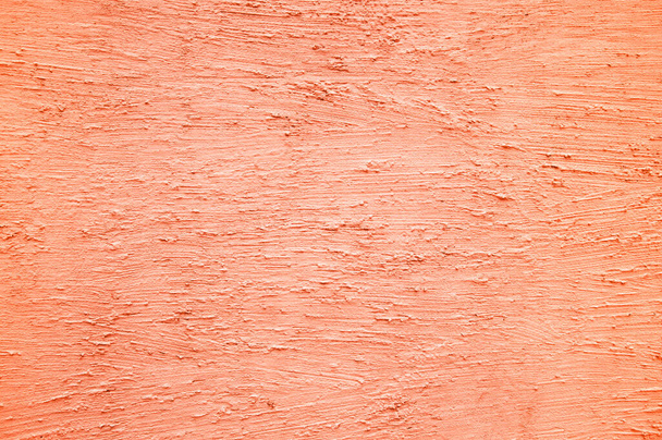 Fondo de yeso, decoración de la pared en color 2024 pelusa melocotón. Foto de alta calidad - Foto, imagen