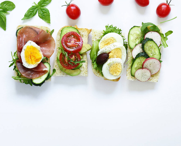 bruschetta sandwiches with ham and vegetables in Italian style - Photo, Image