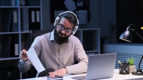 Positive Indian businessman is actively engaged in a video call. Attired in corporate attire, upbeat expressions convey a sense of collaboration and enthusiasm. - Footage, Video