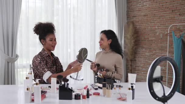 Two women influencer shoot live streaming vlog video review makeup crucial social media or blog. Happy young girl with cosmetics studio lighting for marketing recording session broadcasting online. - Footage, Video