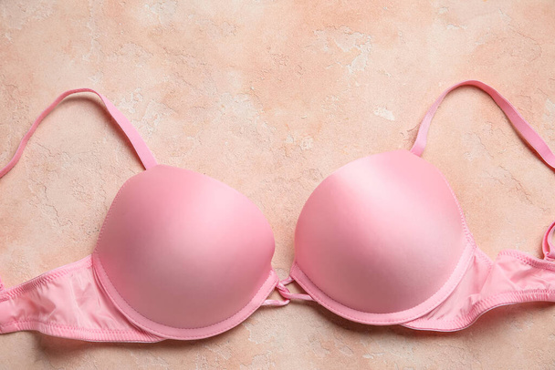 Pink female bra on color background, closeup - Photo, Image