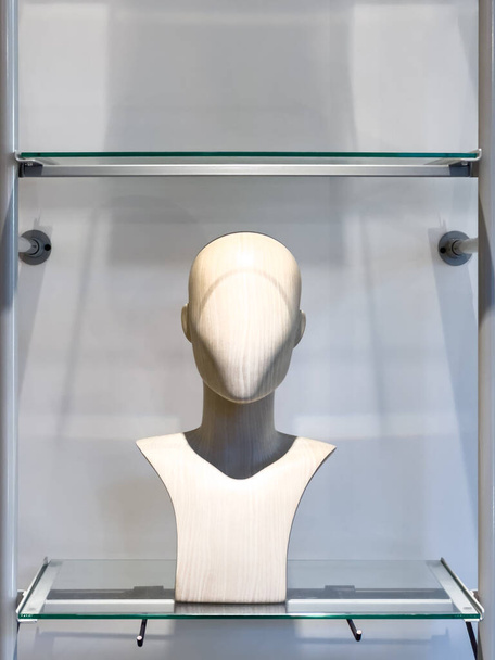 A head and shoulders mannequin used to elegantly display the latest fashion trends in-store, showcasing clothing with poise and style. The manakin model invites shoppers to visualize themselves. - Photo, Image
