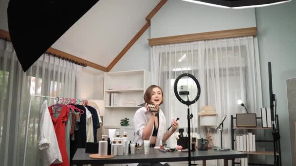 Woman influencer shoot live streaming vlog video review makeup prim social media or blog. Happy young girl with cosmetics studio lighting for marketing recording session broadcasting online. - Footage, Video