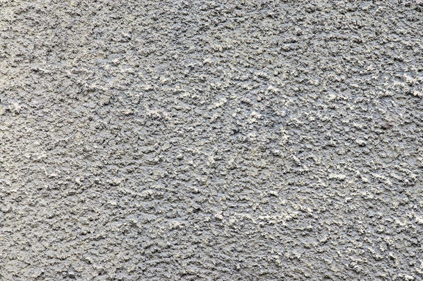 bumpy texture cement wall of dirty gray color - Photo, Image