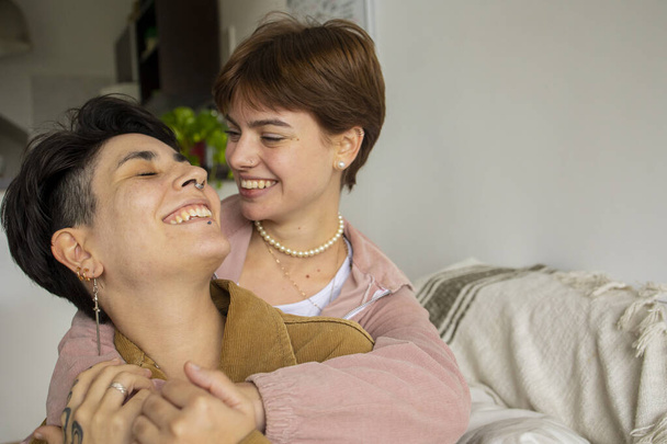 Same sex couple at home spending time. . High quality photo - 写真・画像