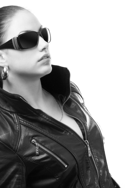 Beautiful girl in black leather jacket and sunglasses isolated o - Фото, зображення