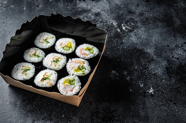 Kimbap or gimbap korean rice roll, Korean sushi. Black background. Top view. Copy space. - 写真・画像