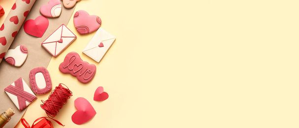 Sweet cookies with decor on yellow background with space for text. Valentine's Day celebration - Photo, Image