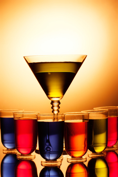 Multi-coloured shots and martini glass - Foto, Bild