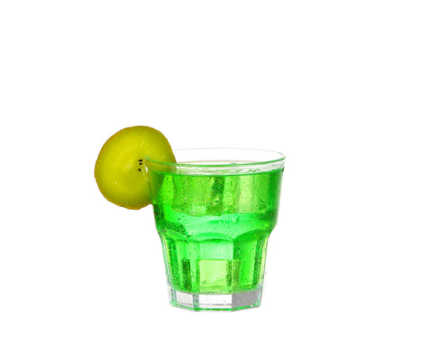 Green alcohol cocktail with splash and green lime isolated on white - Photo, Image